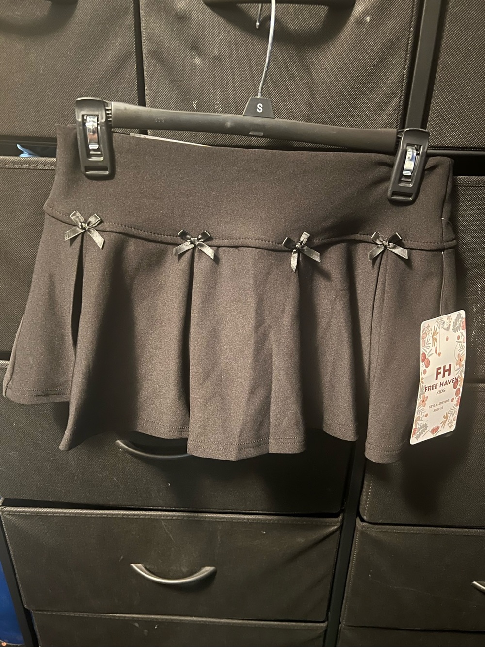 Black Pleated Mini Skirt with Bow Accents